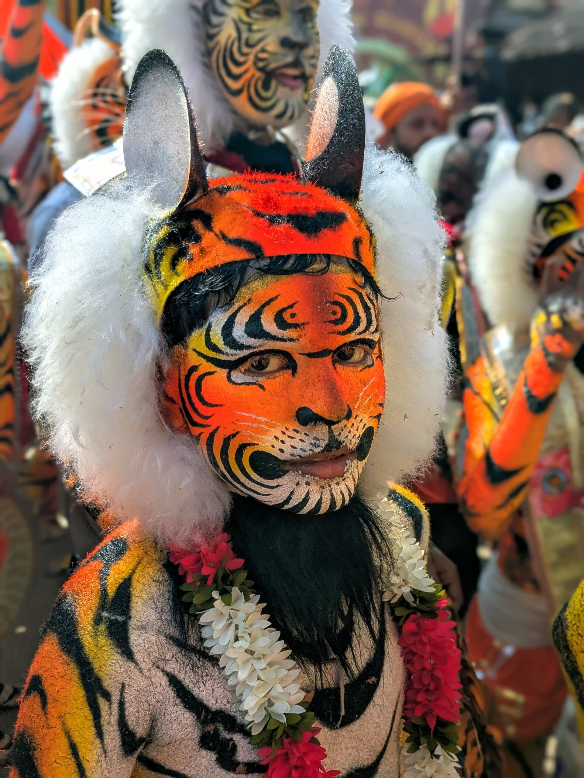 A Huli Vesha performer painted head to toe as a tiger, dancing during Krishna Leelotsava in Udupi