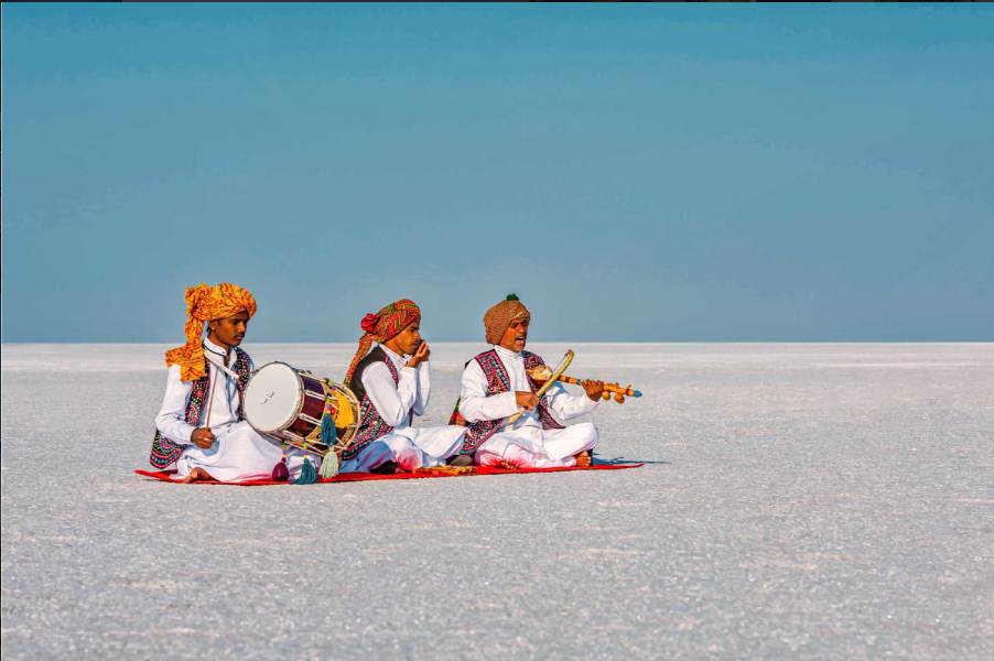The white salt desert of the Rann of Kutch stretching to the horizon at dusk during Rann Utsav